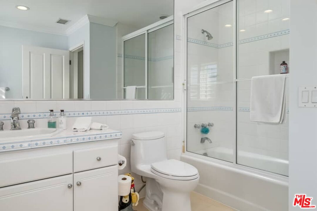 3104 Hutton Drive Beverly Hills, CA 90210 - Photo 24 of 37 a bathroom with a granite countertop sink toilet and shower
