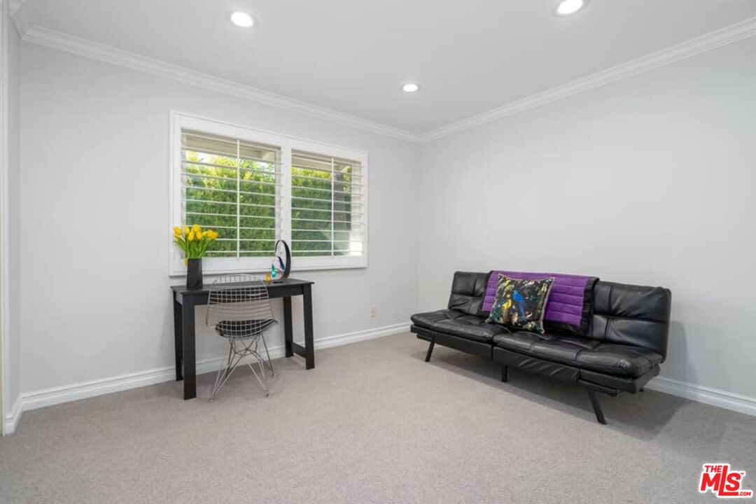 3104 Hutton Drive Beverly Hills, CA 90210 - Photo 25 of 37 a living room with furniture and a potted plant next to a window