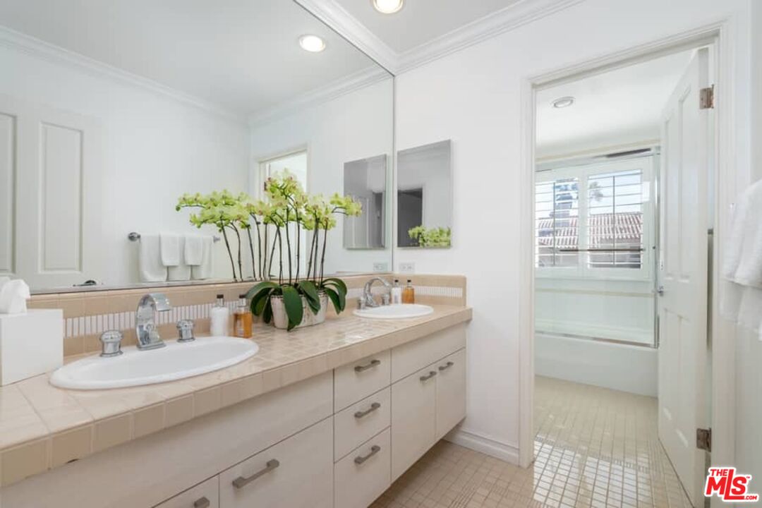 3104 Hutton Drive Beverly Hills, CA 90210 - Photo 26 of 37 a bathroom with a sink double vanity granite and a mirror