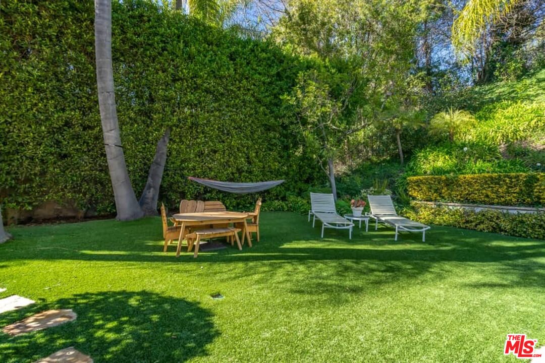 3104 Hutton Drive Beverly Hills, CA 90210 - Photo 30 of 37 a view of a park with trees and wooden fence