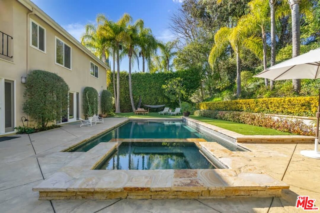 3104 Hutton Drive Beverly Hills, CA 90210 - Photo 31 of 37 a view of swimming pool with palm trees