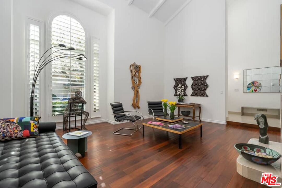 3104 Hutton Drive Beverly Hills, CA 90210 - Photo 6 of 37 a living room with furniture fireplace and a large window