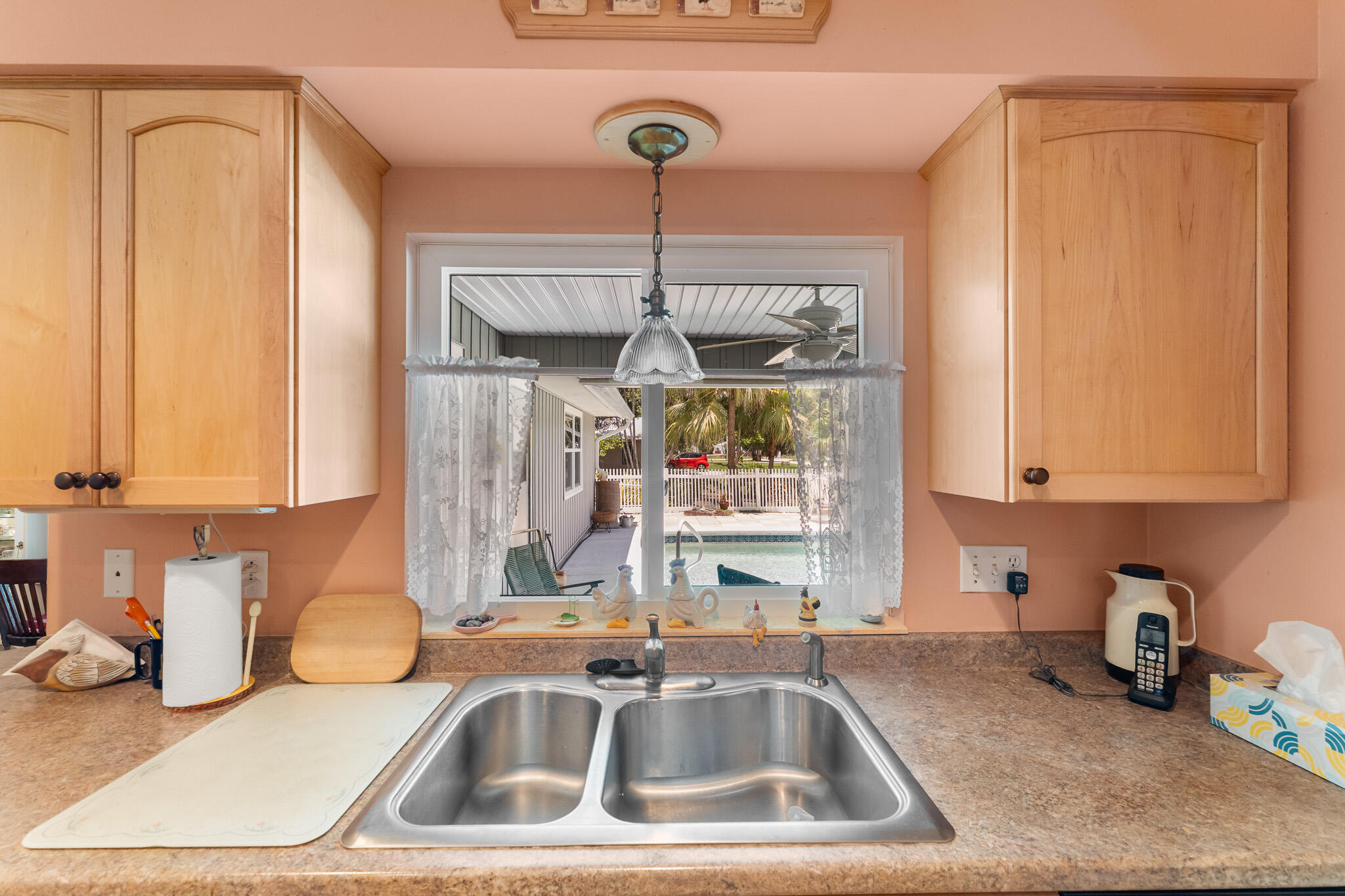 1653 Southwest 85th Terrace Stuart, FL 34997 - Photo 23 of 54 a kitchen with a sink cabinets and window