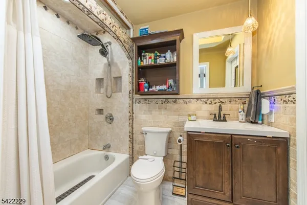 a bathroom with a sink a toilet and a bathtub