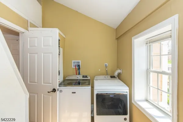 a bathroom with a sink and a washing machine