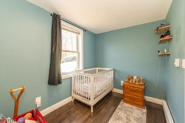a room with a bed and a window