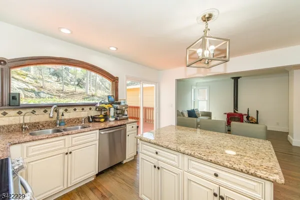 a kitchen with center island and windows