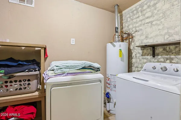 a view of a chairs and table in the patio