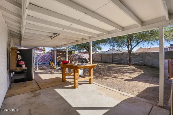 a view of a backyard with sitting area