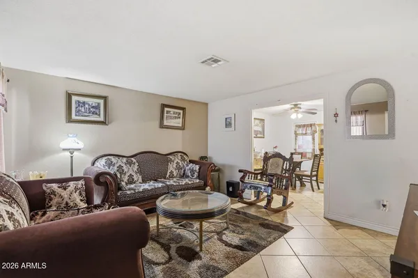 a kitchen with stainless steel appliances granite countertop a refrigerator a stove and a sink