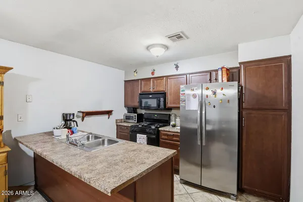 a bedroom with furniture and a chandelier