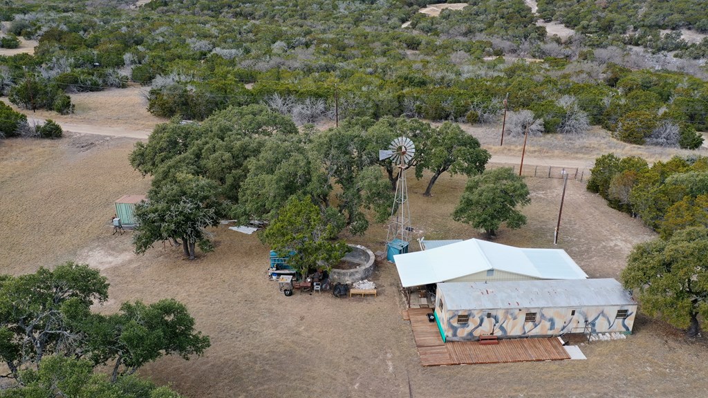 180 Bee Hive Road Hunt, TX 78024 - Photo 16 of 27 an aerial view of a house with a yard and lake view