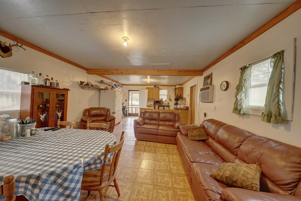 180 Bee Hive Road Hunt, TX 78024 - Photo 24 of 27 a living room with furniture and a chandelier