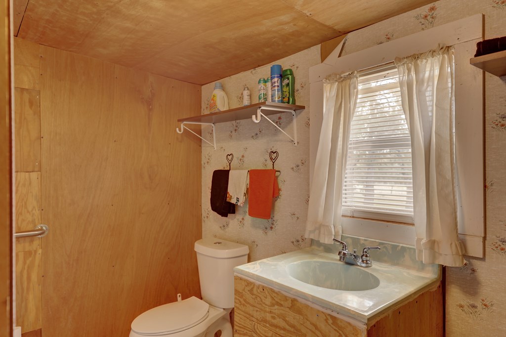 180 Bee Hive Road Hunt, TX 78024 - Photo 26 of 27 a bathroom with a sink and a mirror