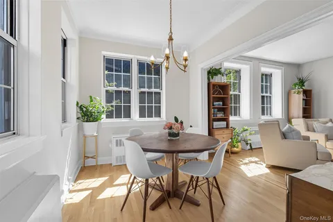 a bedroom with a large bed and ceiling fan