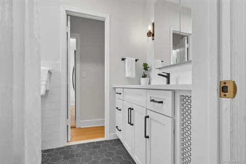 a bathroom with a sink and a mirror
