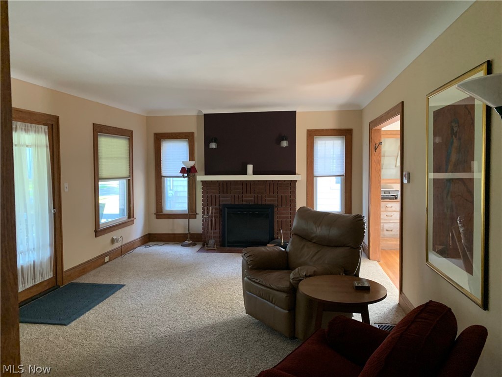5131 Eastover Road Cleveland, OH 44124 - Photo 4 of 21 Living room features a brick fireplace.