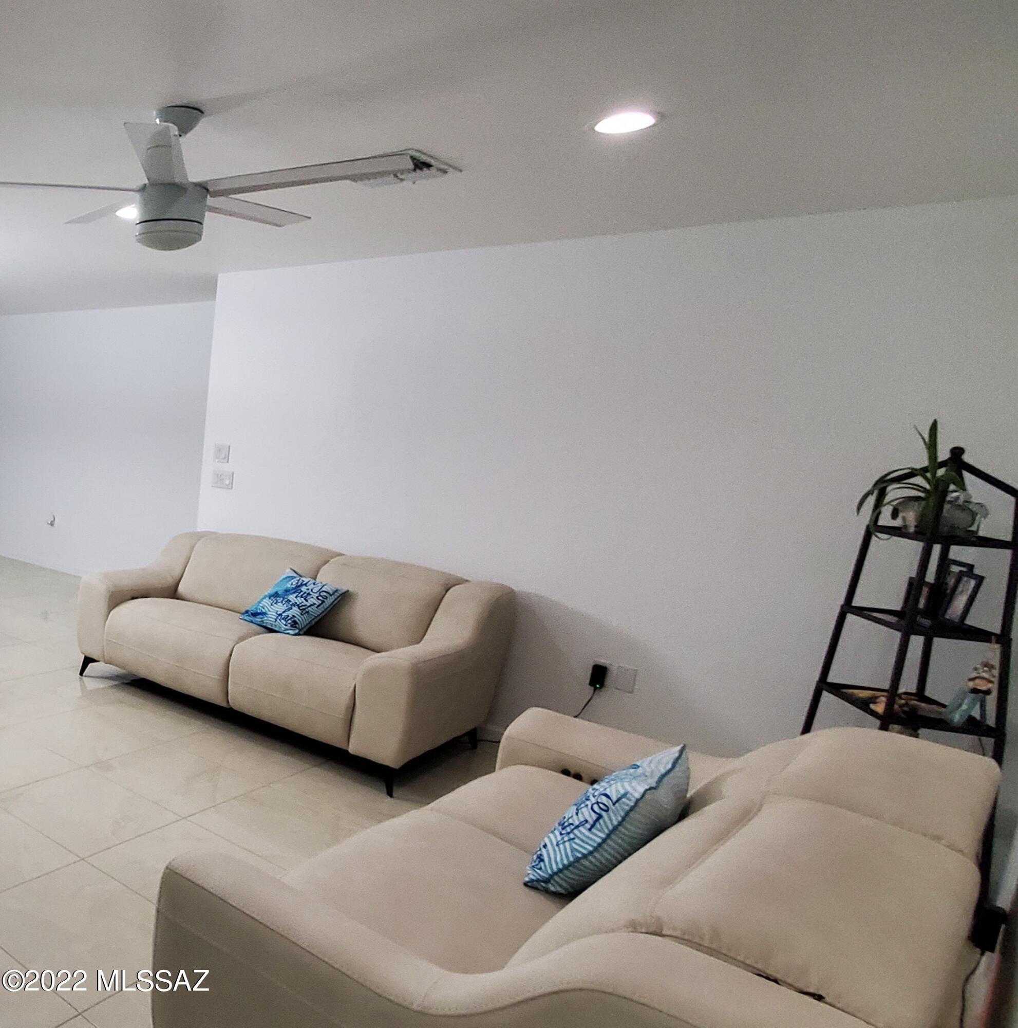 126 Avenida Ostion Rio Rico, AZ 85648 - Photo 22 of 31 a living room with furniture and rug