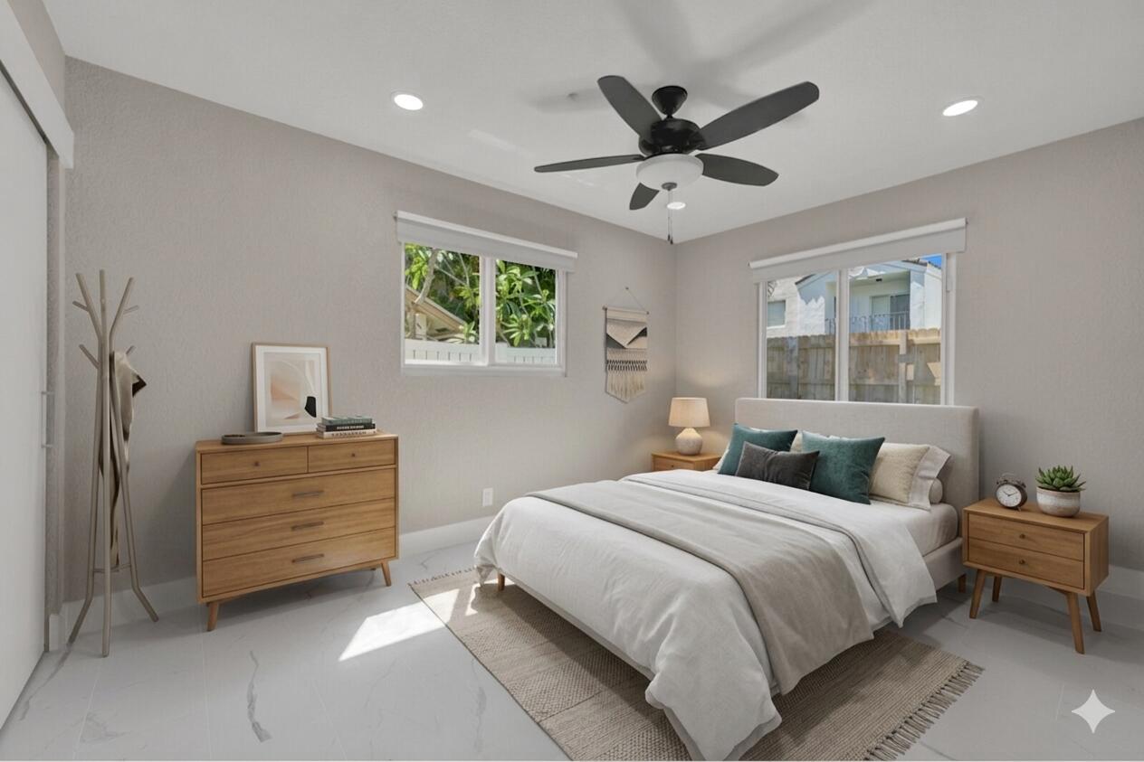 23392 East Country Club Drive East Boca Raton, FL 33428 - Photo 11 of 21 a bedroom with a bed and a window