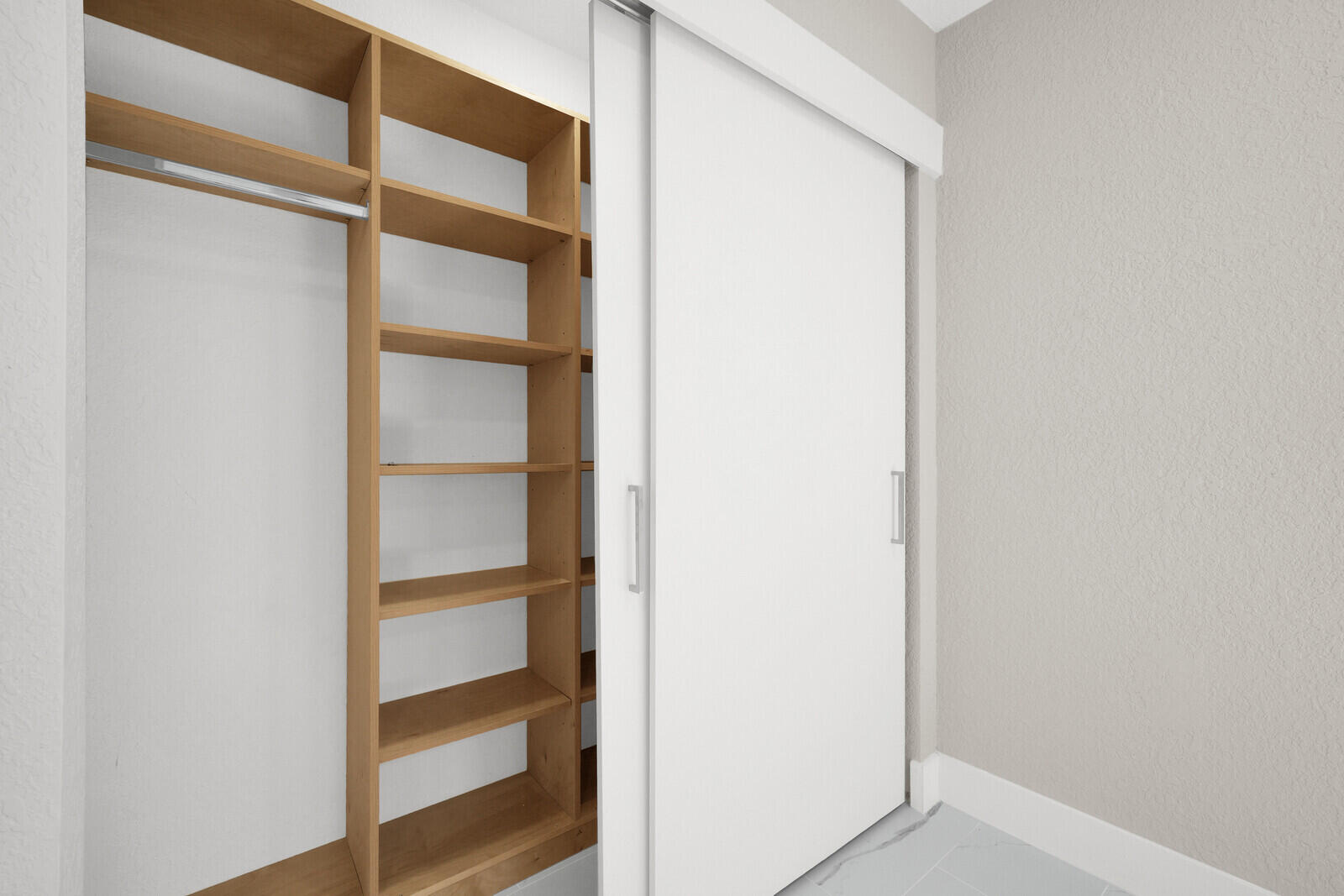 23392 East Country Club Drive East Boca Raton, FL 33428 - Photo 12 of 21 a view of walk in closet with empty racks