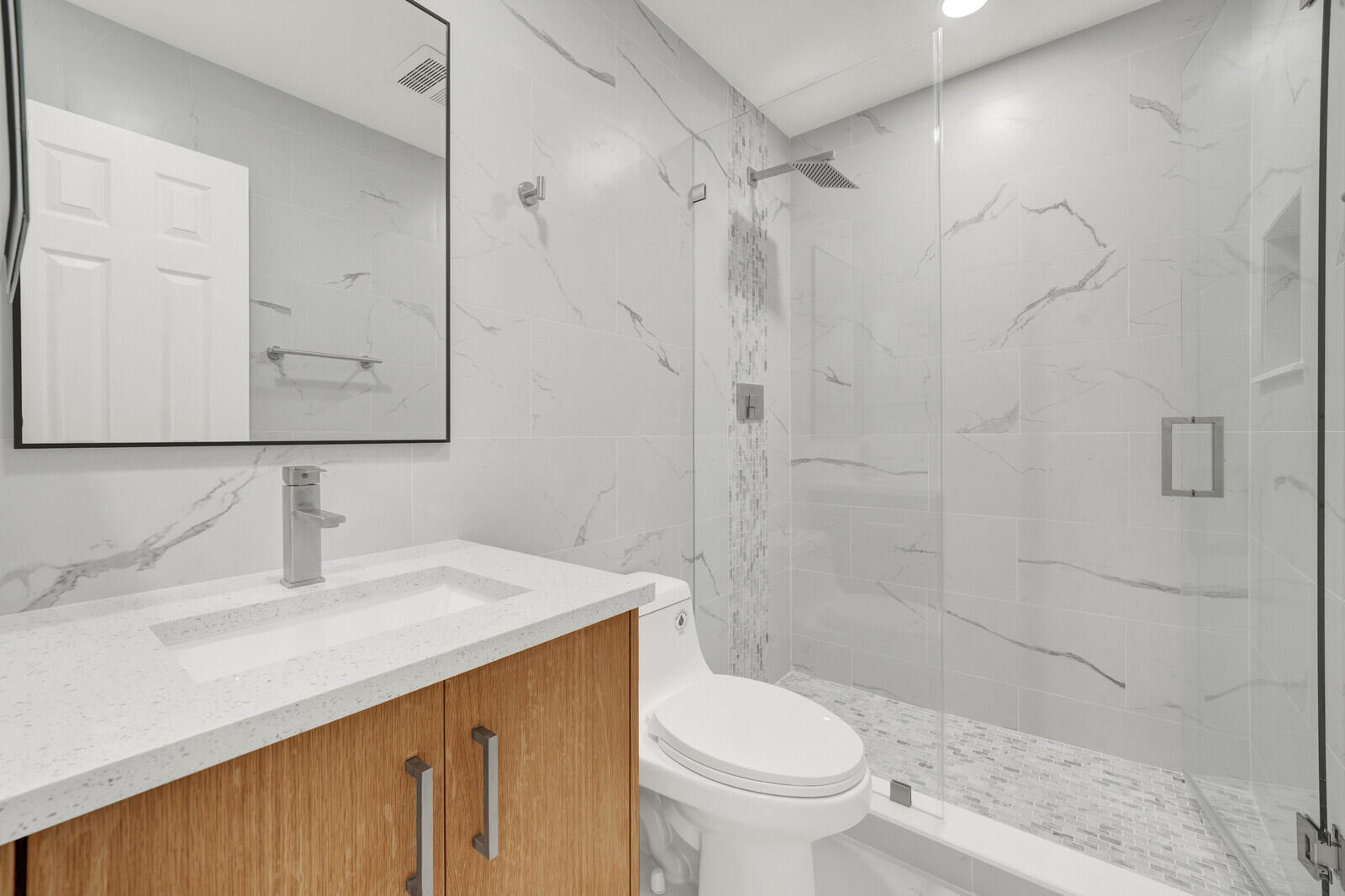 23392 East Country Club Drive East Boca Raton, FL 33428 - Photo 15 of 21 a bathroom with a sink a toilet and shower