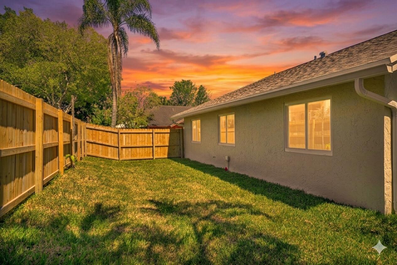 23392 East Country Club Drive East Boca Raton, FL 33428 - Photo 2 of 21 a view of backyard of house with green space
