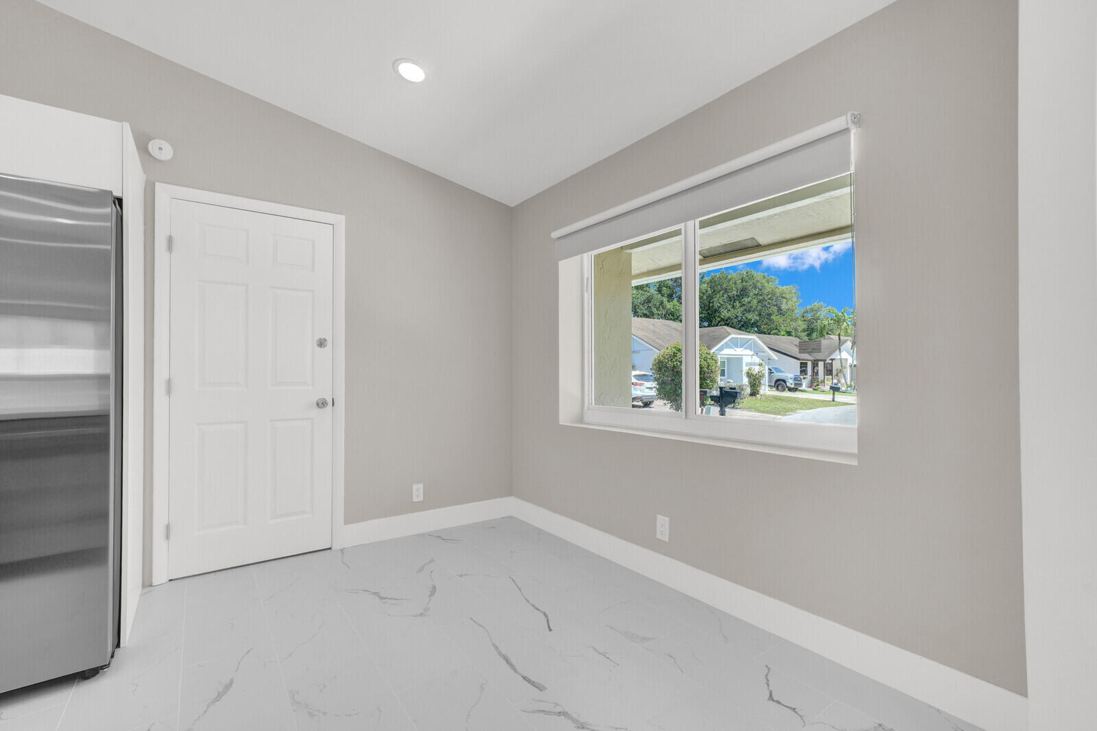 23392 East Country Club Drive East Boca Raton, FL 33428 - Photo 9 of 21 an empty room with windows and closet