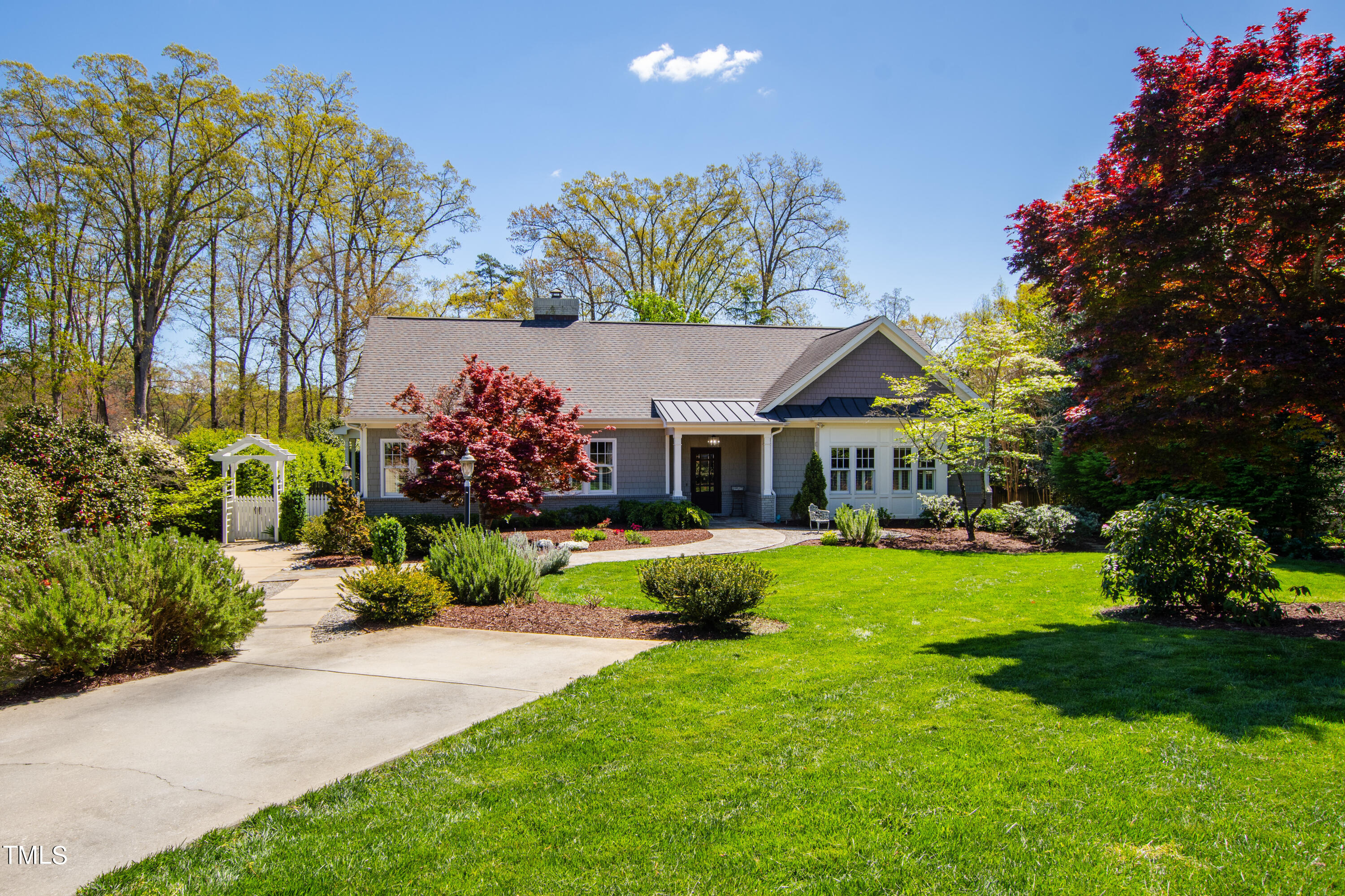 2210 Coley Forest Place Raleigh, NC 27607 - Photo 1 of 44 a front view of a house with garden