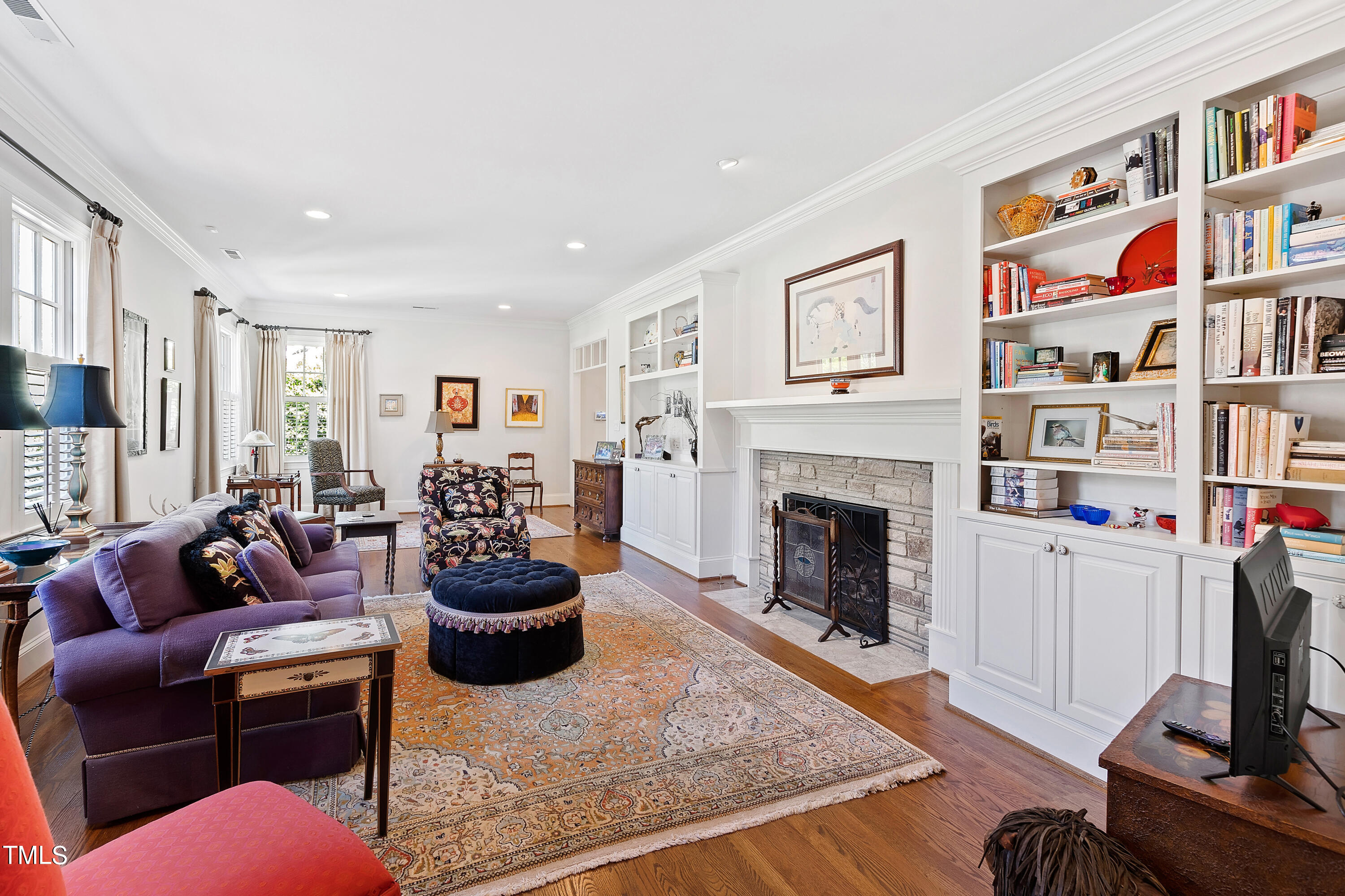 2210 Coley Forest Place Raleigh, NC 27607 - Photo 11 of 44 a living room with furniture and a fireplace