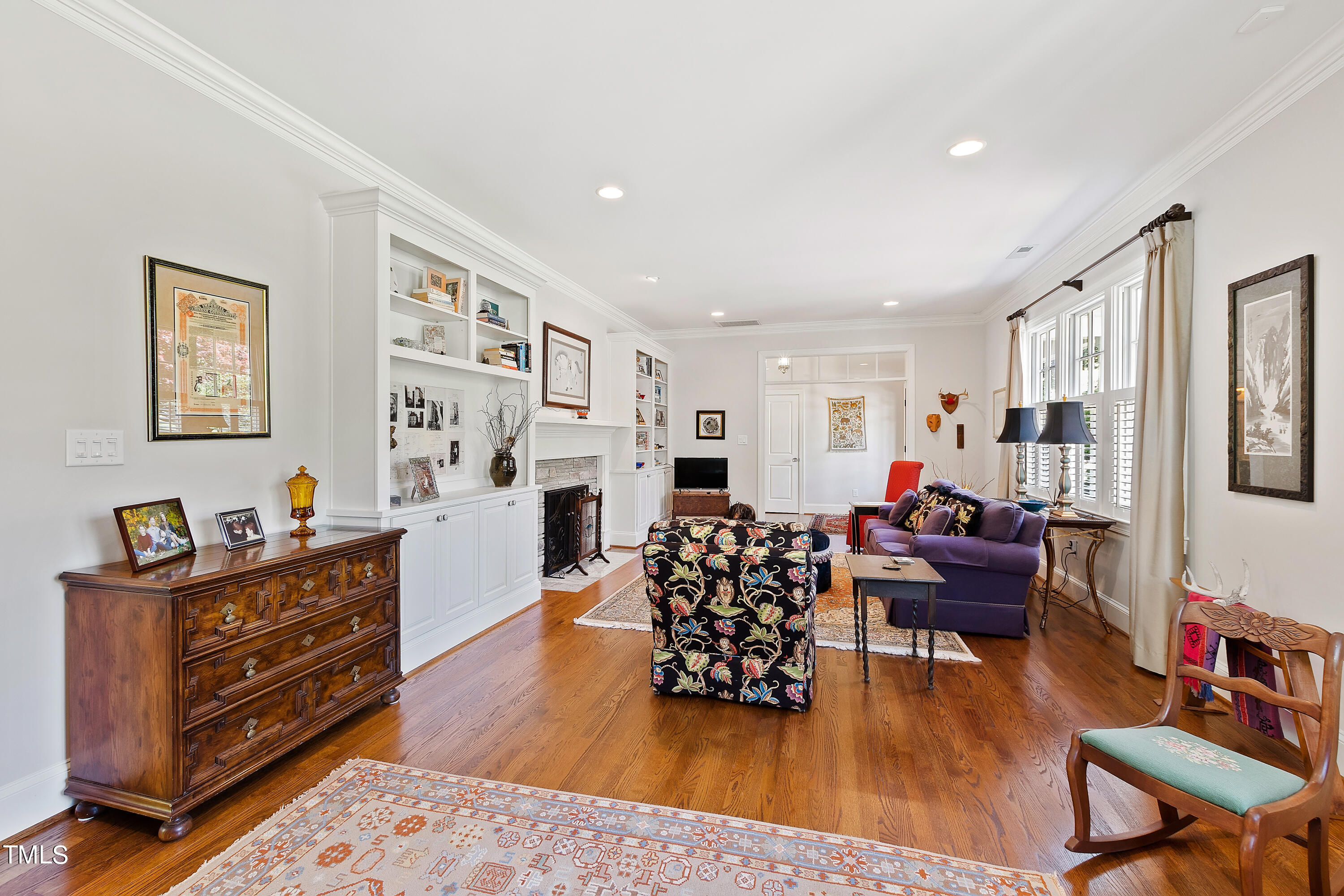 2210 Coley Forest Place Raleigh, NC 27607 - Photo 13 of 44 a living room with furniture and wooden floor