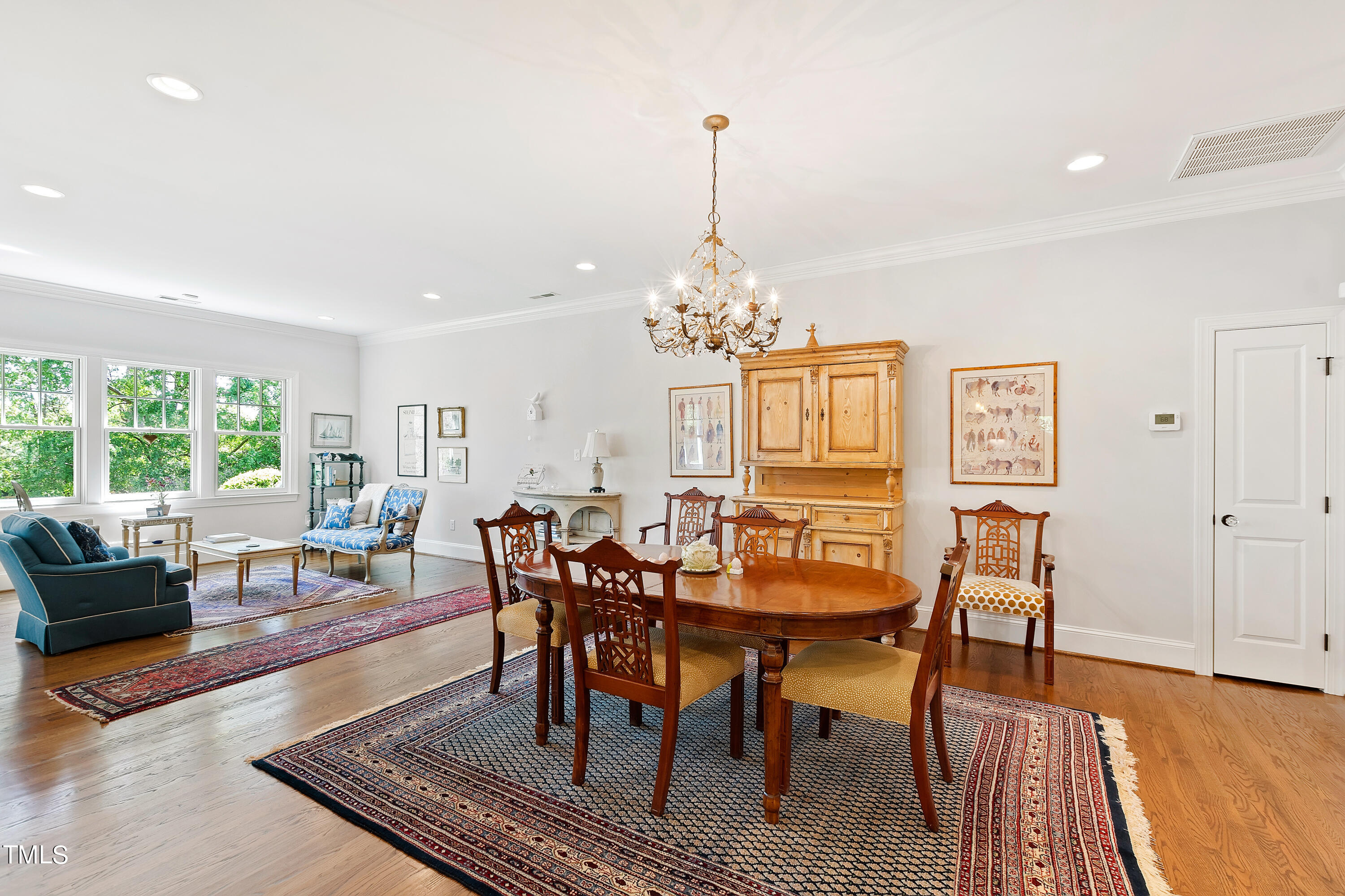 2210 Coley Forest Place Raleigh, NC 27607 - Photo 14 of 44 a view of a dining room with furniture window and wooden floor