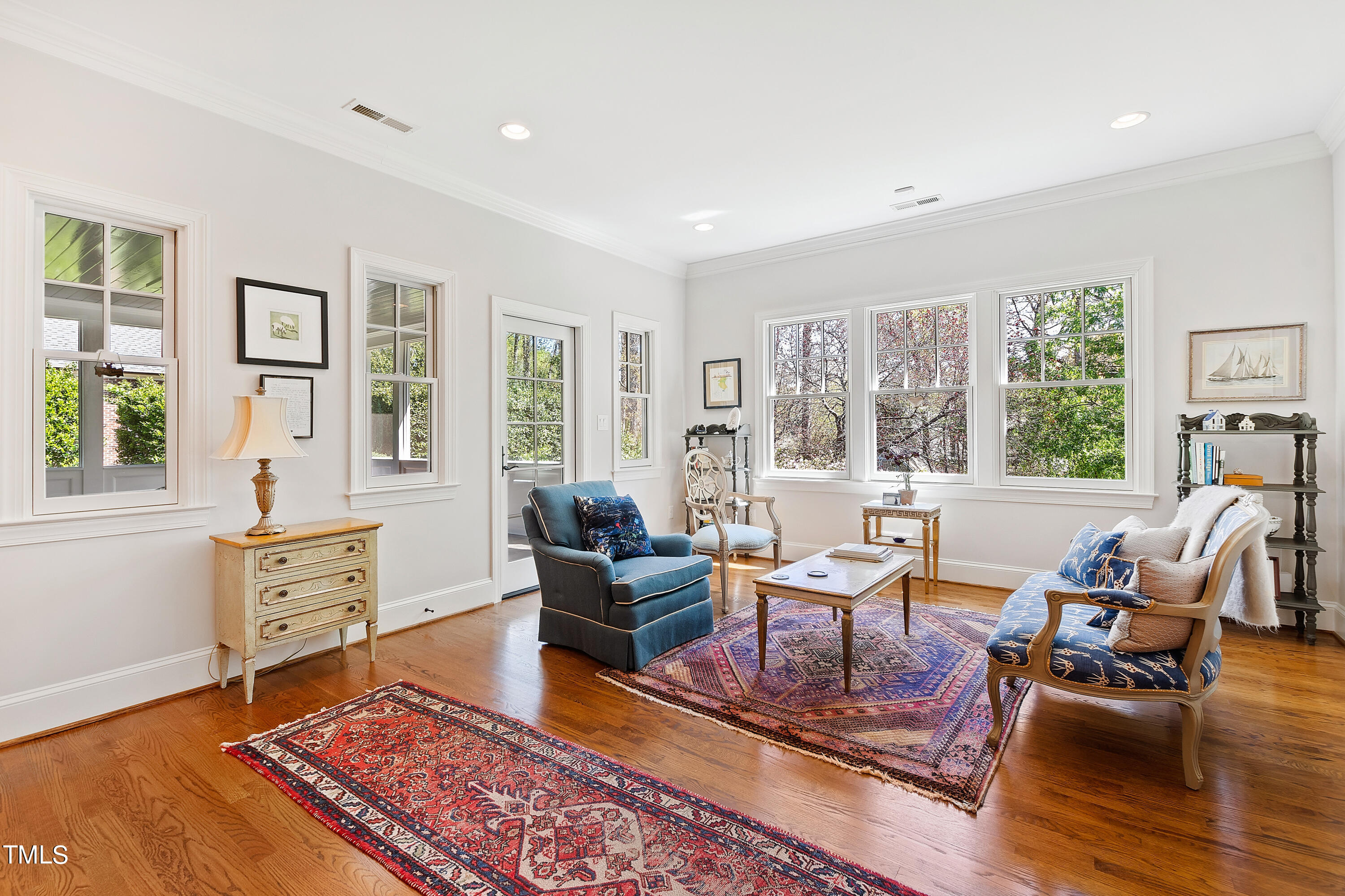 2210 Coley Forest Place Raleigh, NC 27607 - Photo 15 of 44 a living room with furniture large window and wooden floor
