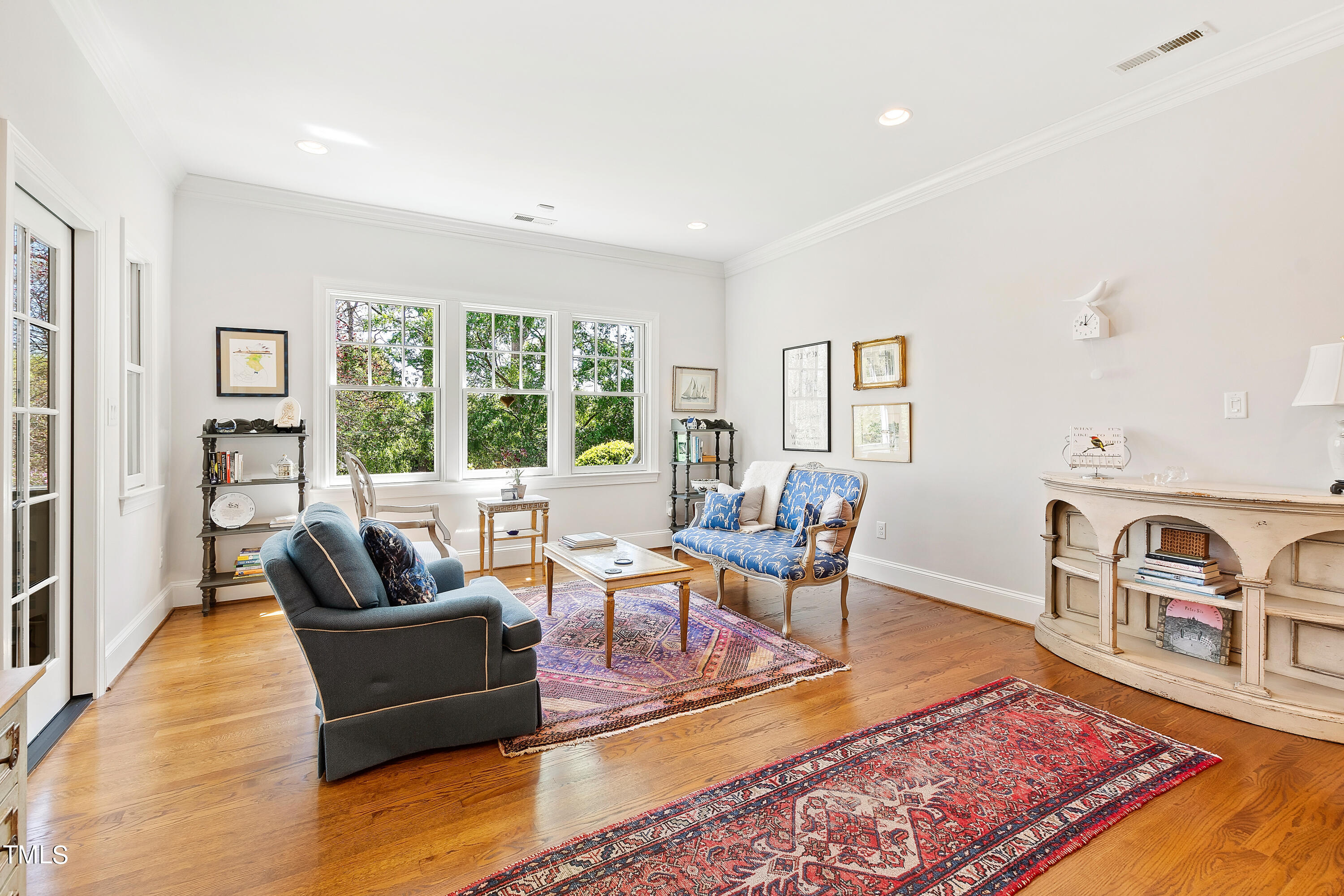2210 Coley Forest Place Raleigh, NC 27607 - Photo 16 of 44 a living room with furniture and a rug