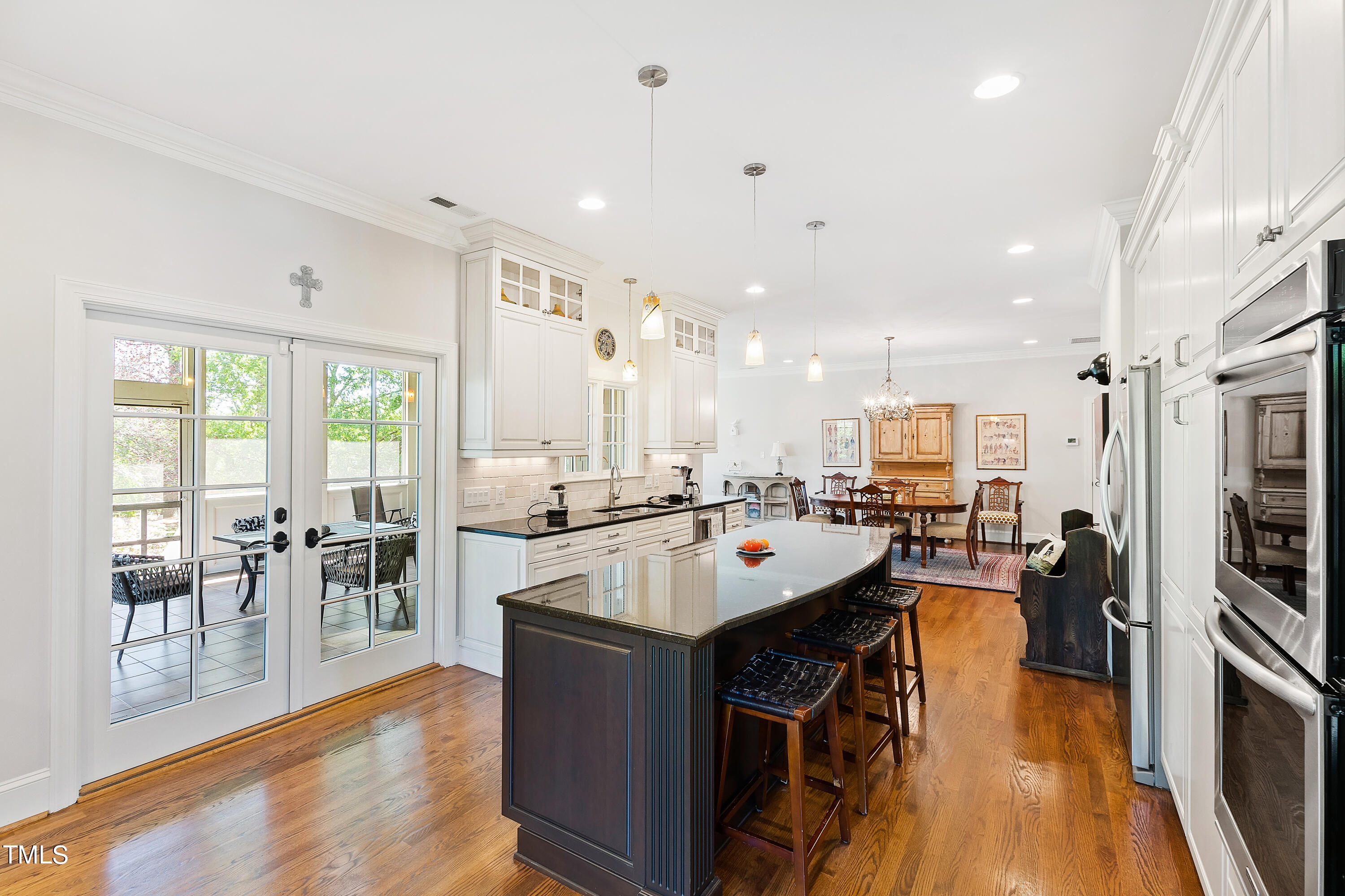2210 Coley Forest Place Raleigh, NC 27607 - Photo 19 of 44 a kitchen with lots of counter top space and stainless steel appliances