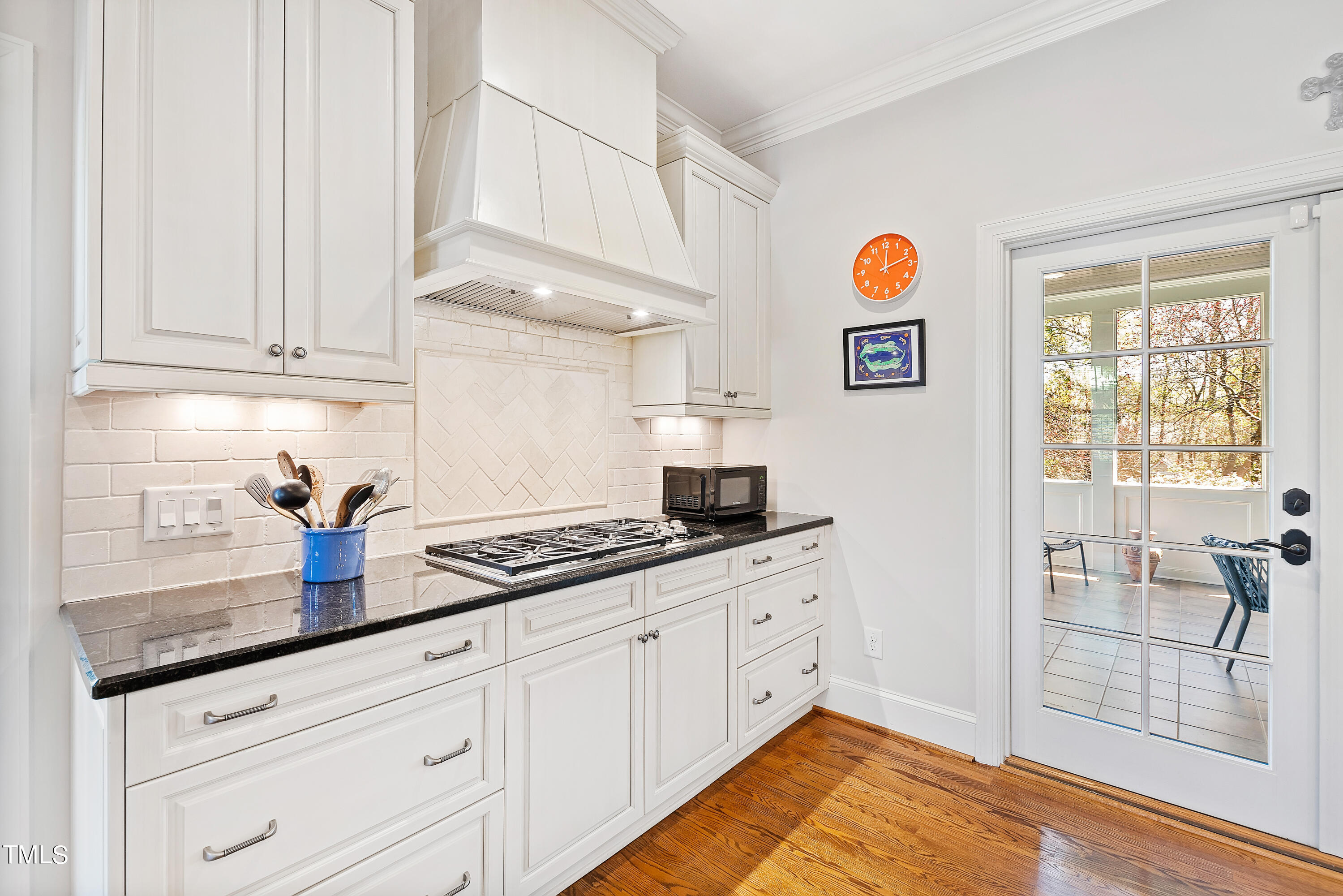 2210 Coley Forest Place Raleigh, NC 27607 - Photo 21 of 44 a kitchen with granite countertop a sink and cabinets