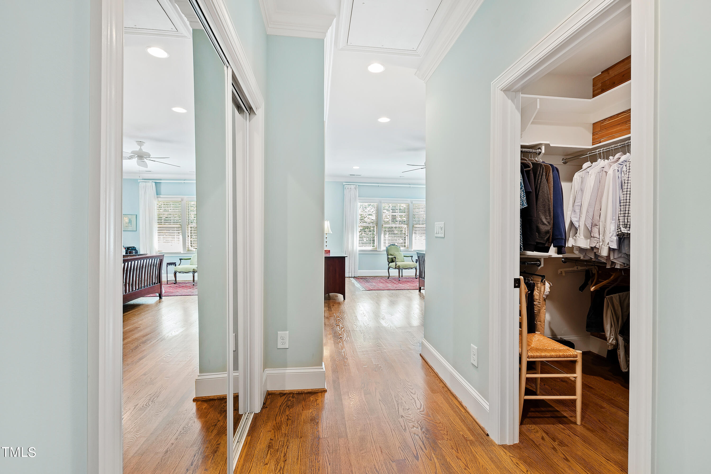 2210 Coley Forest Place Raleigh, NC 27607 - Photo 23 of 44 a view of a hallway with wooden floor and a living room