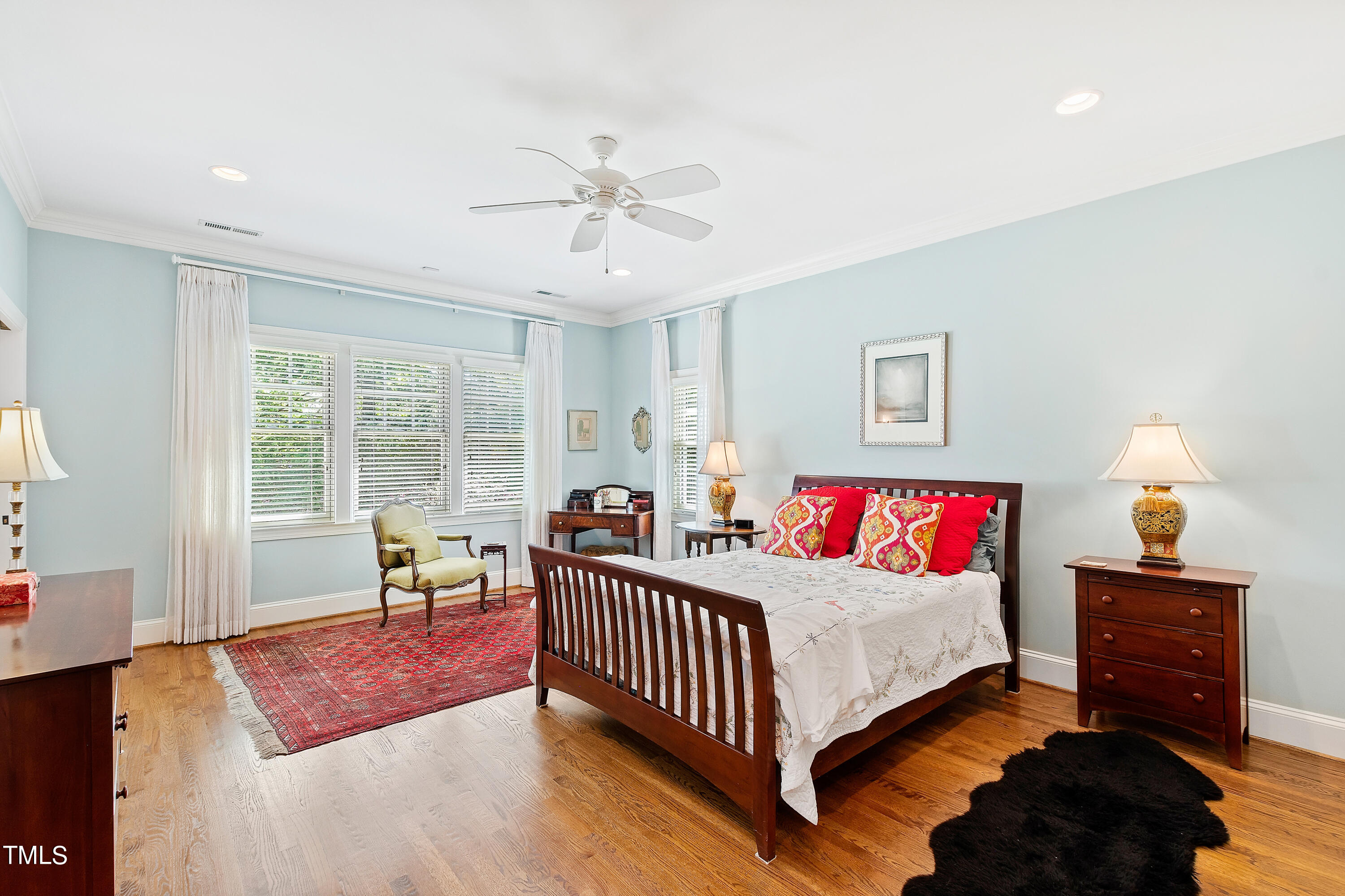 2210 Coley Forest Place Raleigh, NC 27607 - Photo 24 of 44 a bedroom with a bed and wooden floor