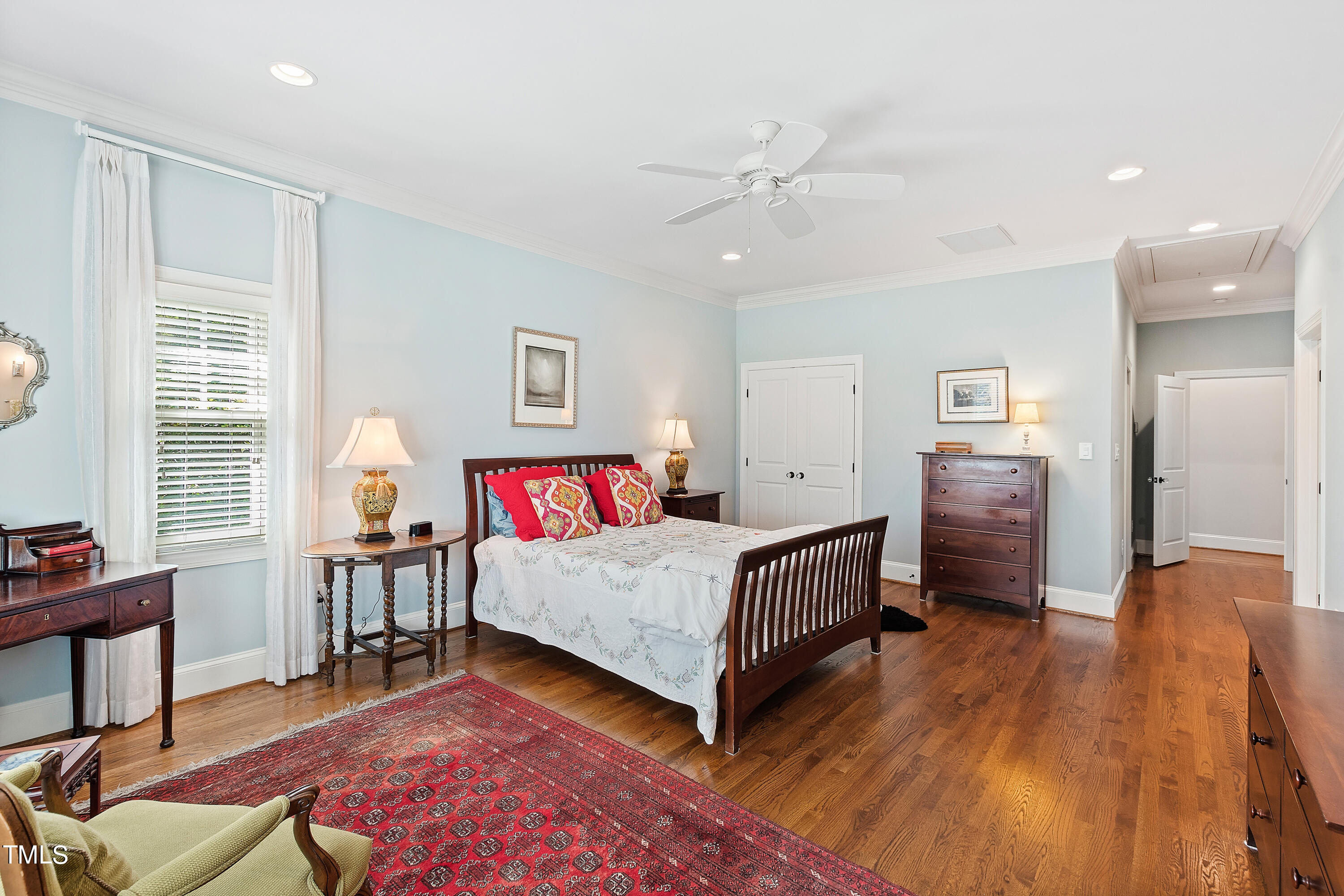 2210 Coley Forest Place Raleigh, NC 27607 - Photo 25 of 44 a bedroom with a bed and a table in it