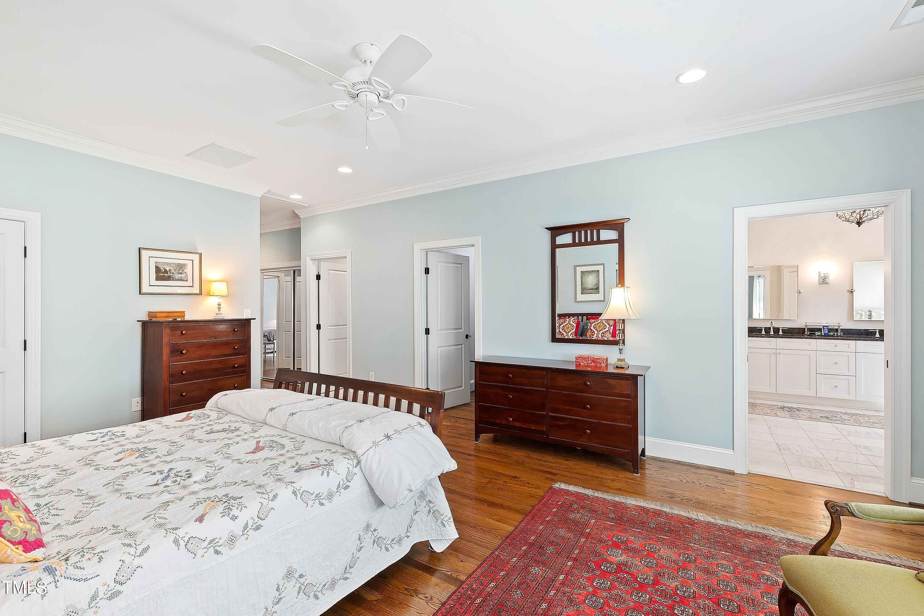 2210 Coley Forest Place Raleigh, NC 27607 - Photo 26 of 44 a spacious bedroom with a bed and a dresser