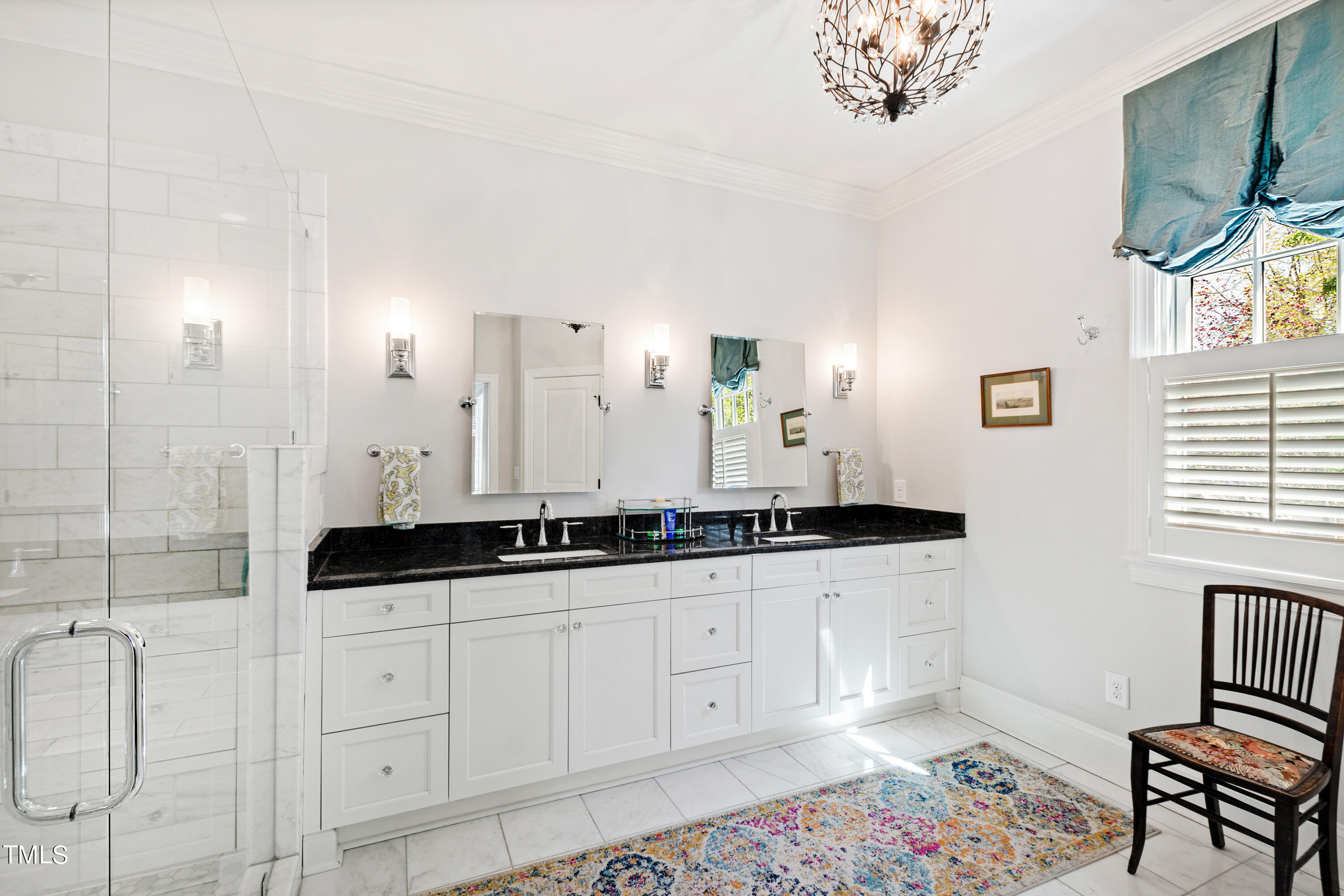 2210 Coley Forest Place Raleigh, NC 27607 - Photo 27 of 44 a spacious bathroom with a granite countertop sink a mirror a vanity and a bathtub