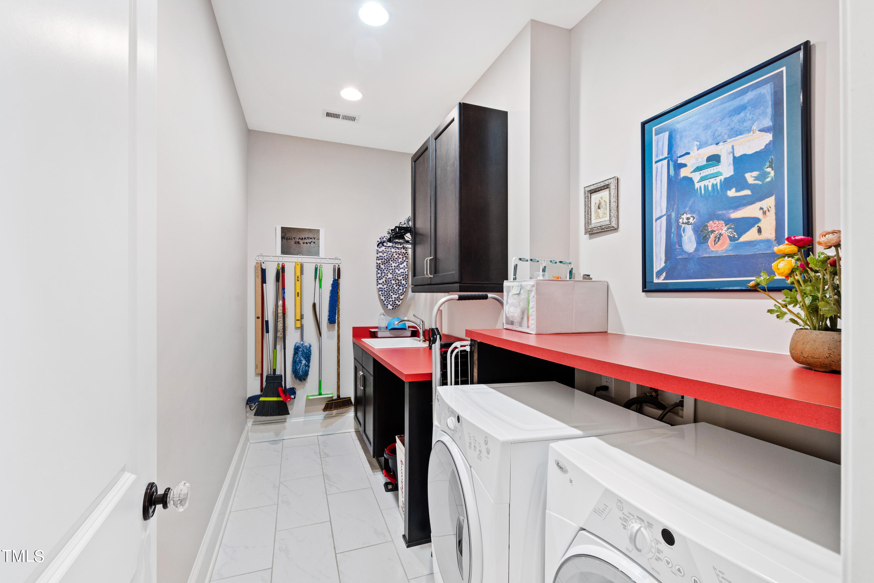 2210 Coley Forest Place Raleigh, NC 27607 - Photo 28 of 44 a room with a washer and dryer