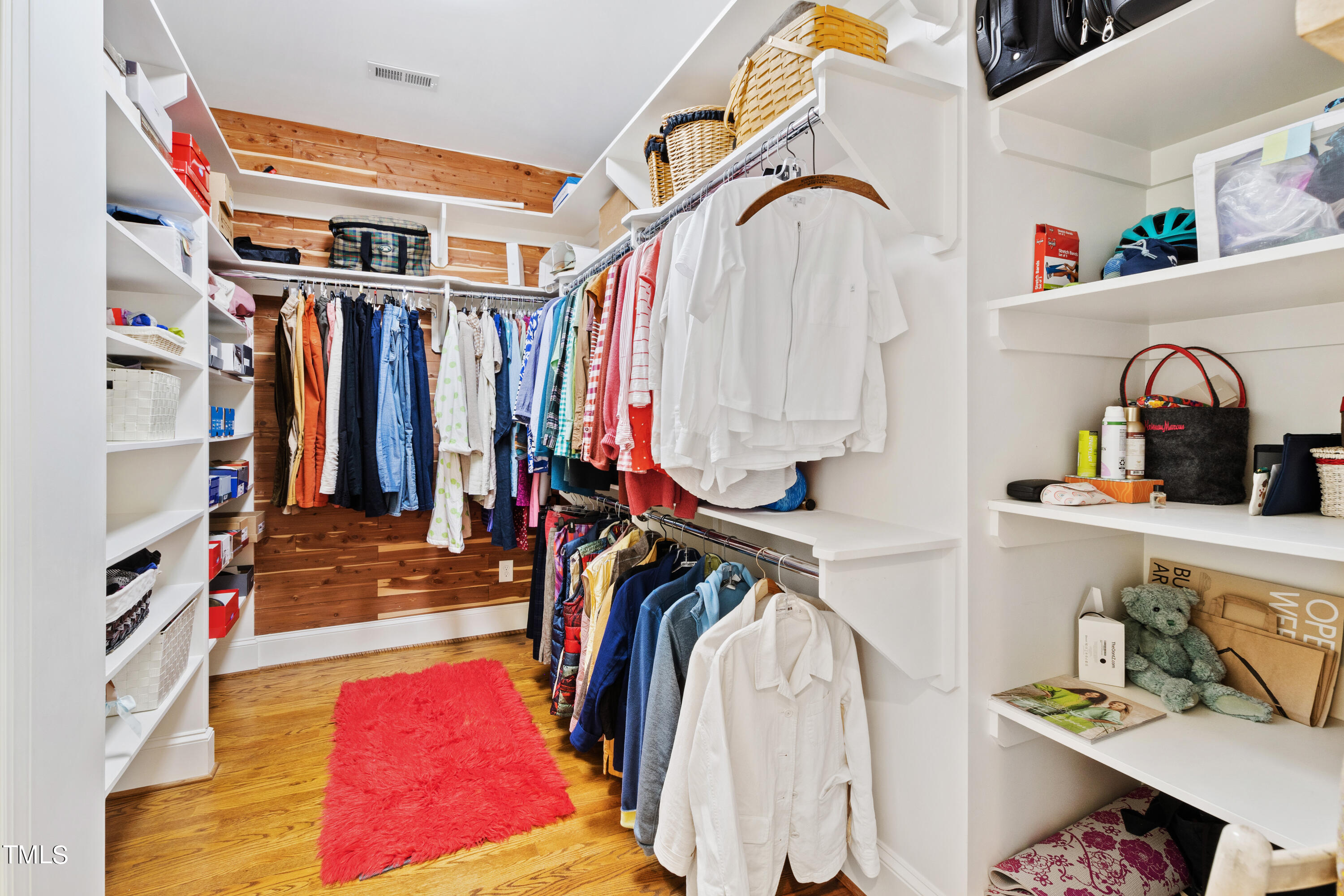 2210 Coley Forest Place Raleigh, NC 27607 - Photo 29 of 44 a view of walk in closet with clothes and shoes