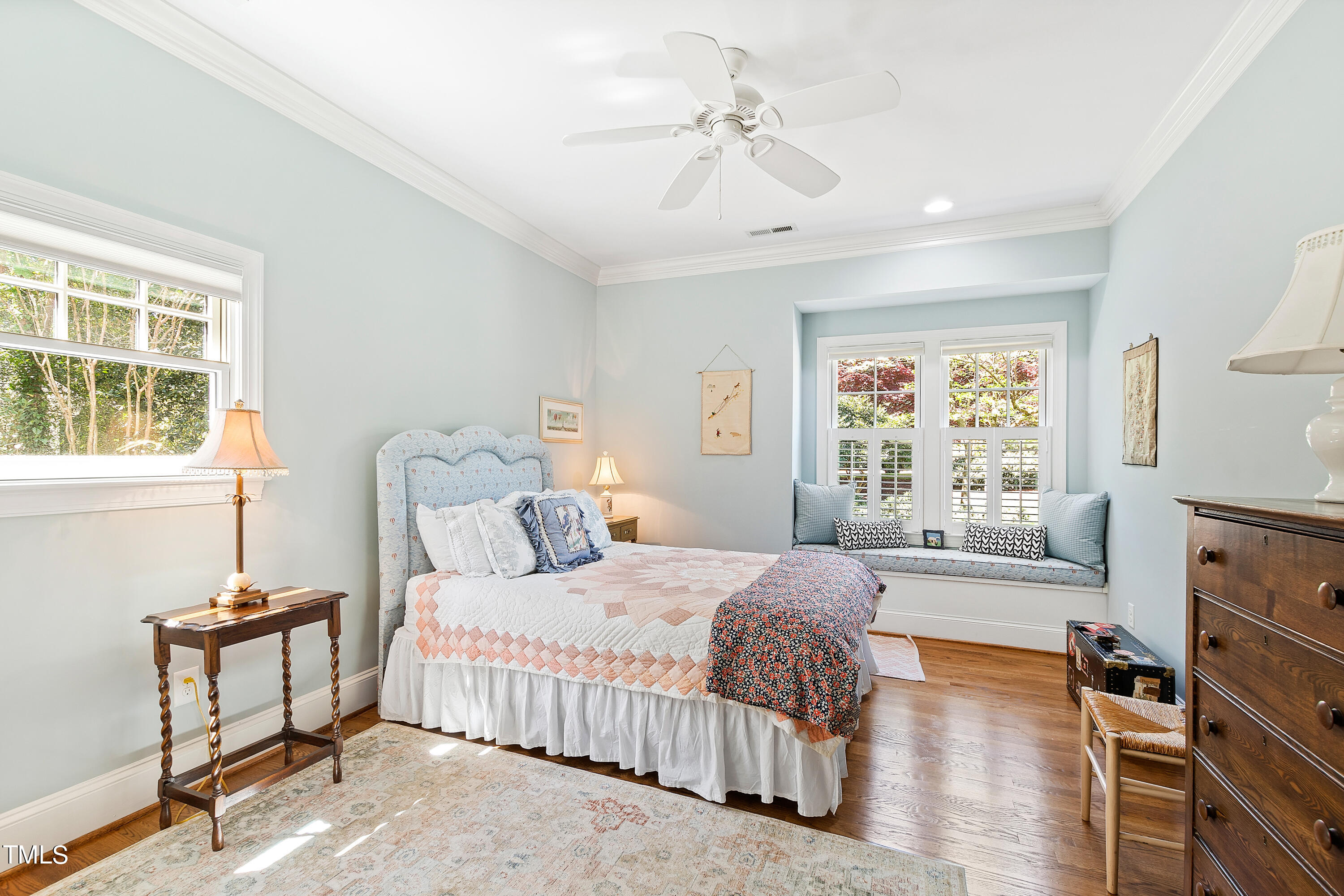 2210 Coley Forest Place Raleigh, NC 27607 - Photo 30 of 44 a bedroom with a bed and a window