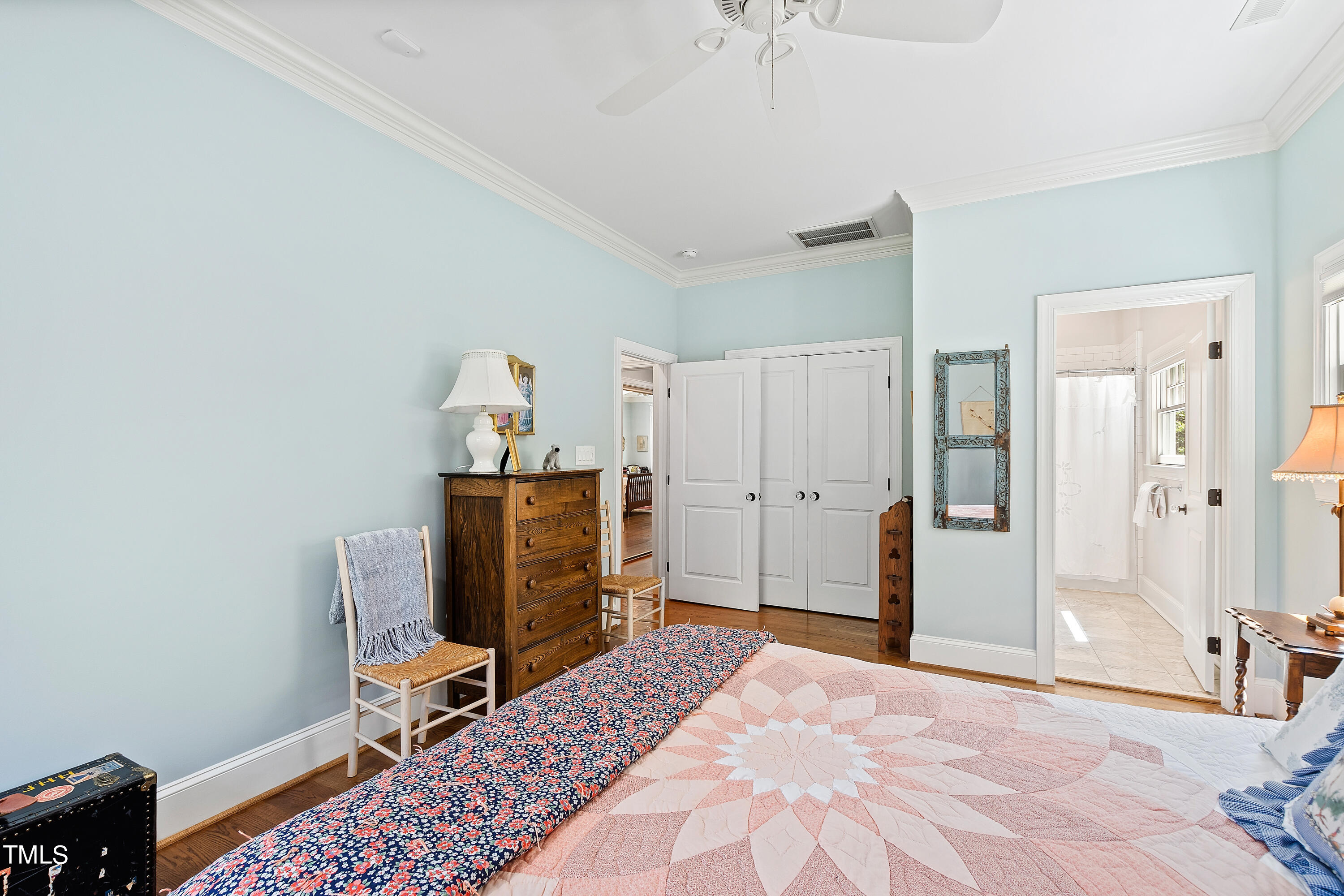2210 Coley Forest Place Raleigh, NC 27607 - Photo 31 of 44 a bedroom with a bed and a desk