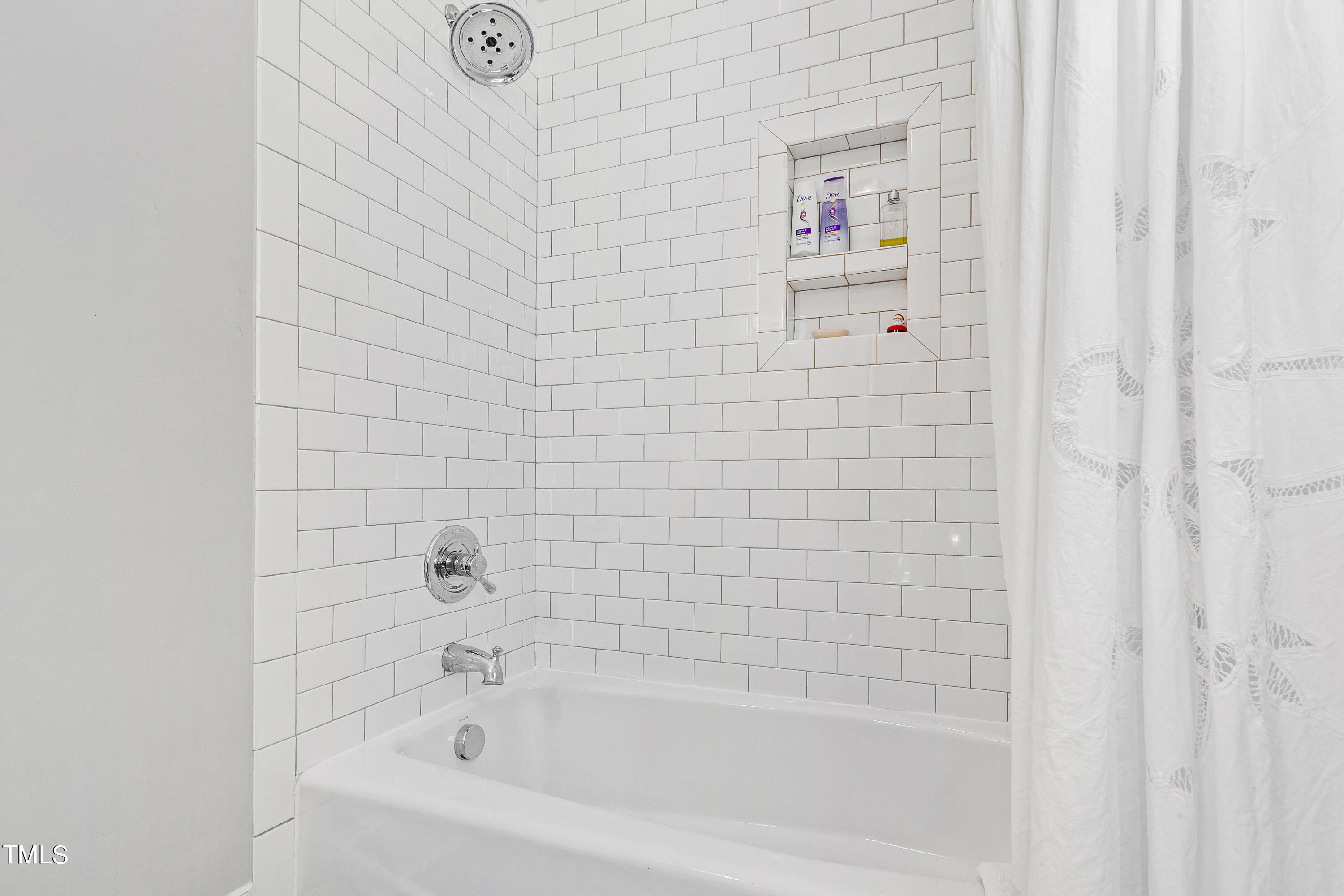2210 Coley Forest Place Raleigh, NC 27607 - Photo 33 of 44 a close up of a bathtub curtain