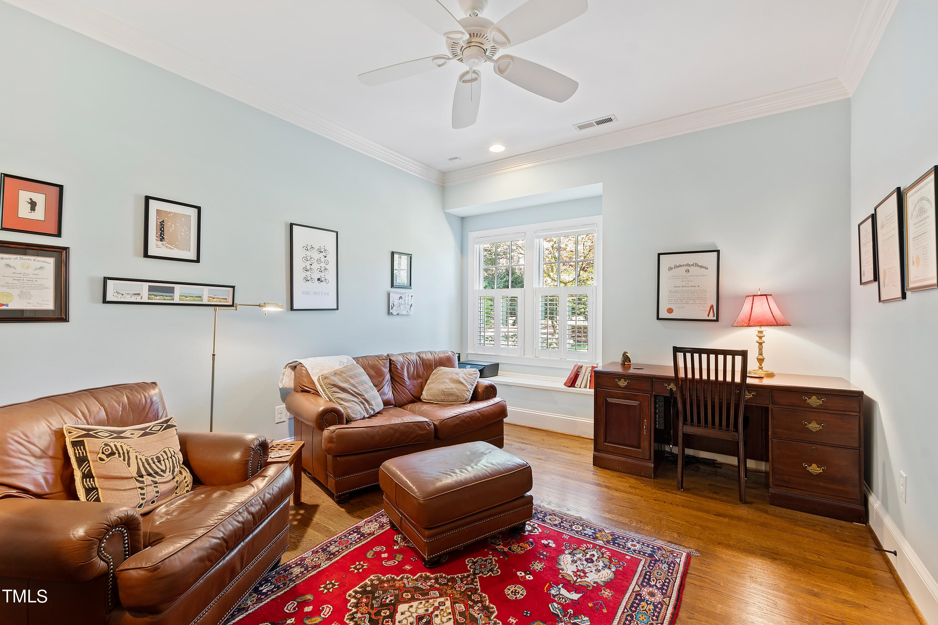 2210 Coley Forest Place Raleigh, NC 27607 - Photo 34 of 44 a living room with furniture and a window