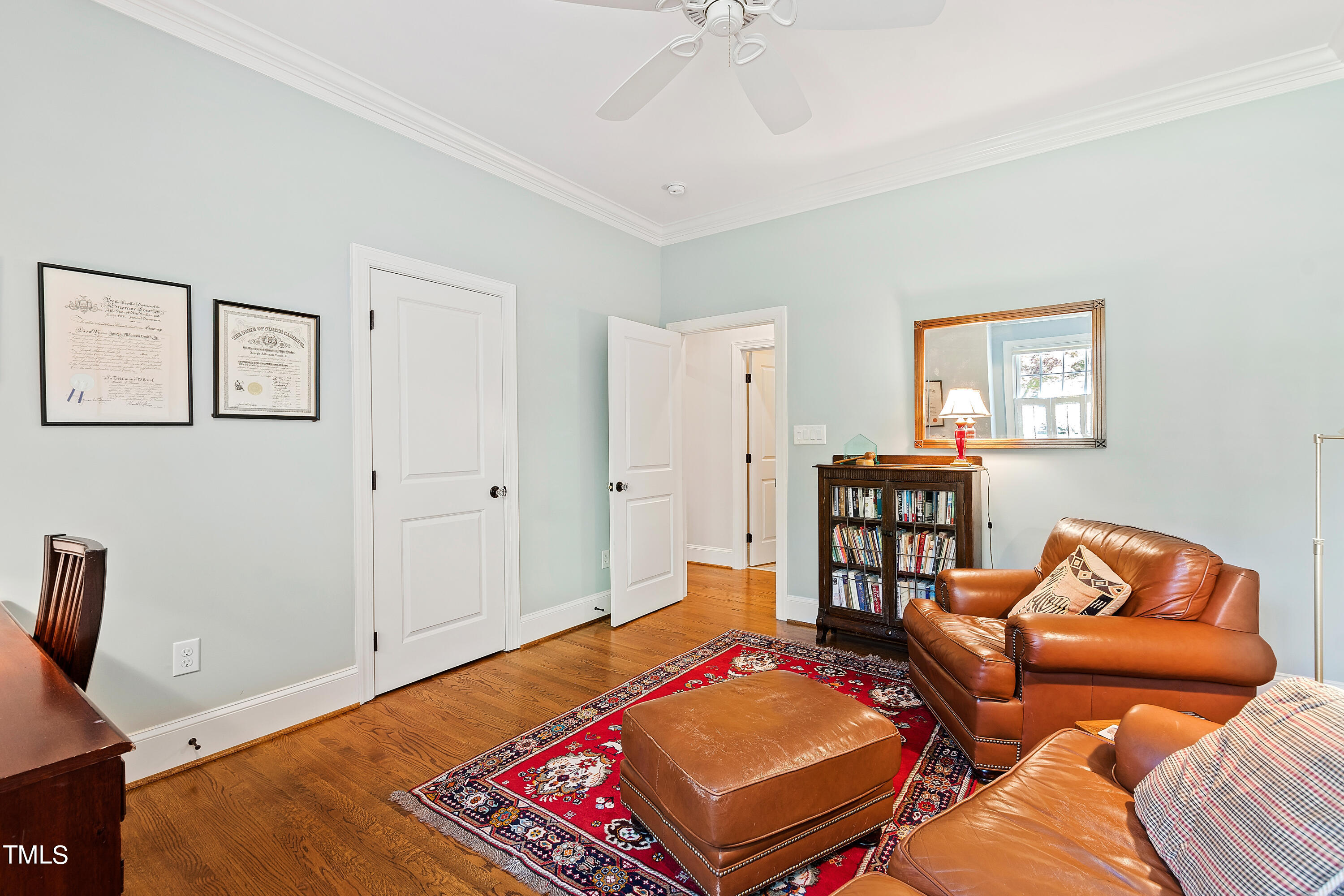 2210 Coley Forest Place Raleigh, NC 27607 - Photo 35 of 44 a bedroom with a bed and furniture