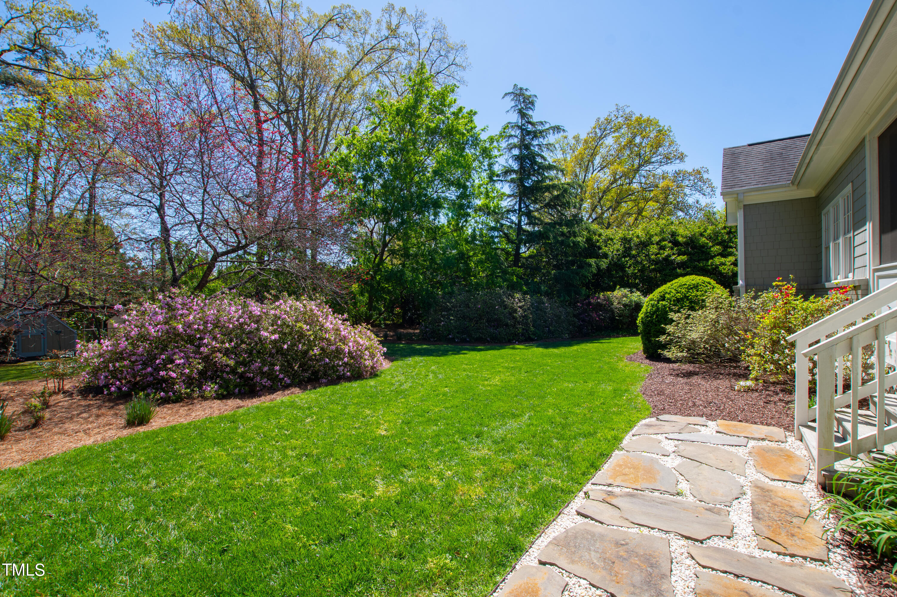 2210 Coley Forest Place Raleigh, NC 27607 - Photo 39 of 44 a view of a garden with a fountain