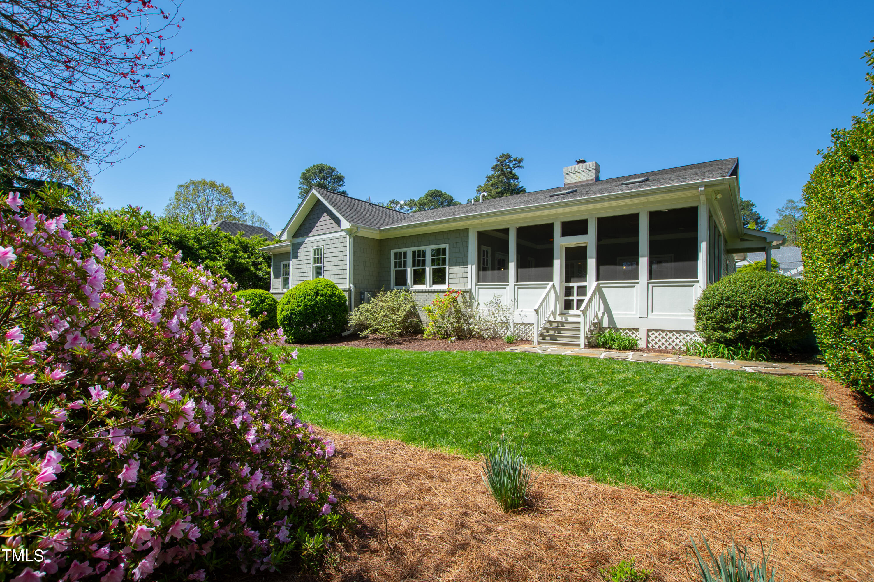 2210 Coley Forest Place Raleigh, NC 27607 - Photo 41 of 44 a front view of a house with a yard and potted plants