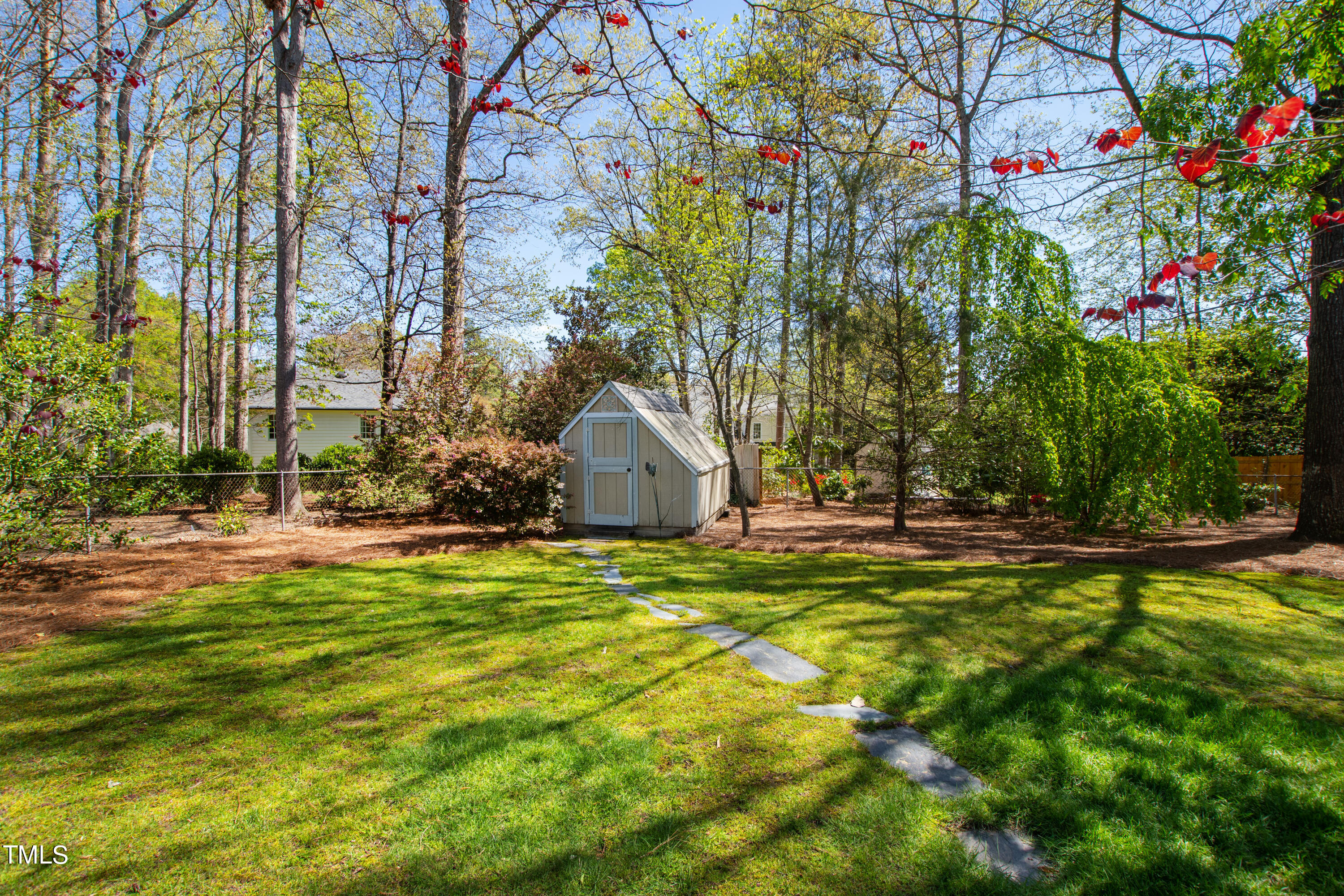 2210 Coley Forest Place Raleigh, NC 27607 - Photo 42 of 44 a front view of a house with swimming pool and sitting area